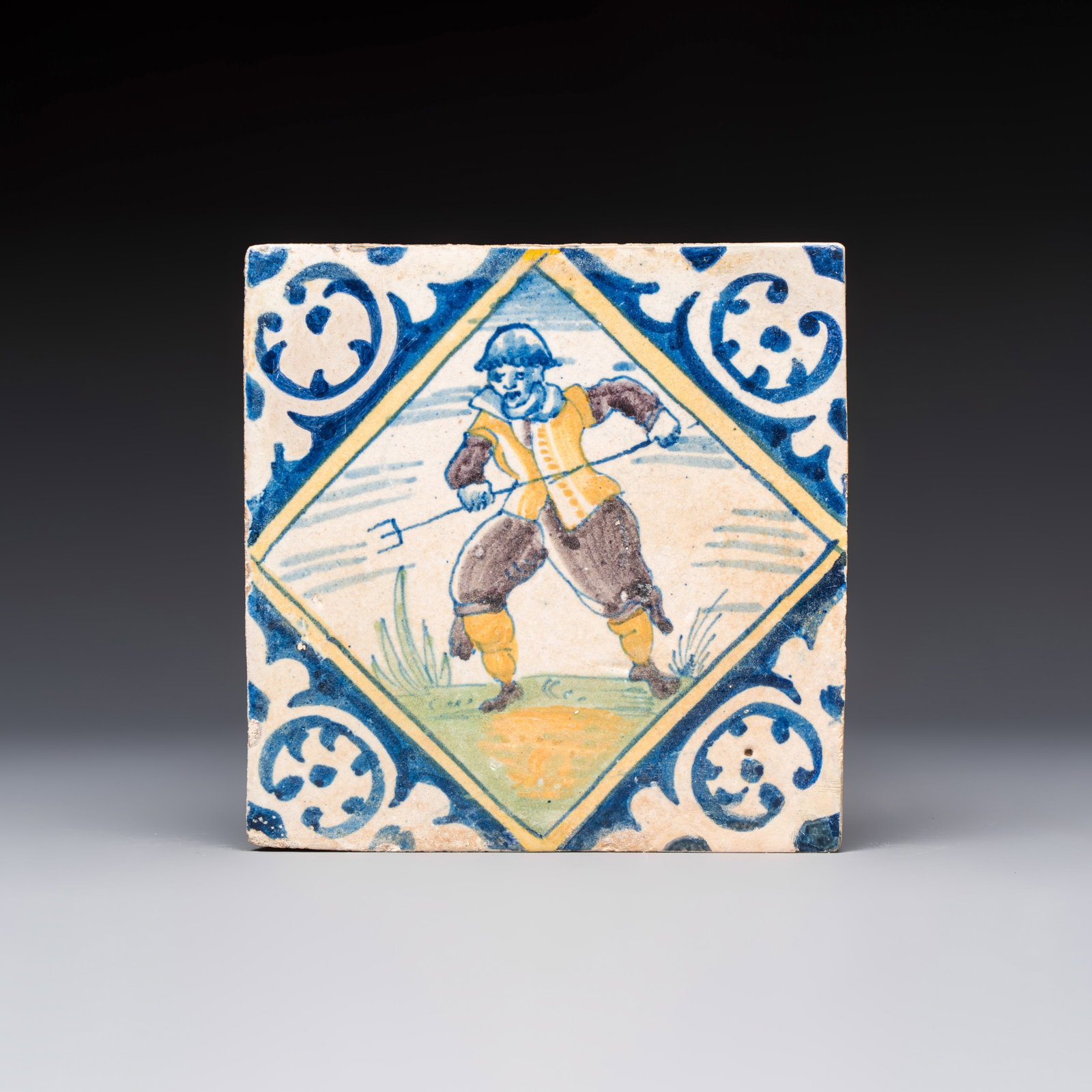 A polychrome Dutch Delft maiolica 'Soldier' diamond tile, 16th C. (1 of 2)