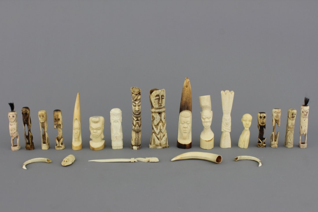 A collection of African ivory and bone sculptures, 20th: Comprising 22 pieces. Hight of tallest: 21 cm