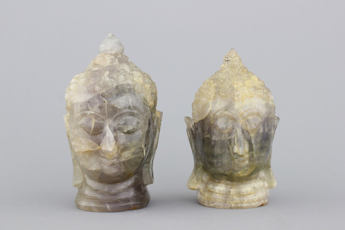 A pair of Chinese carved quartz buddha heads, 20th C. (1 of 2)