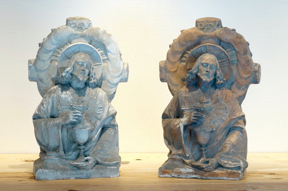 A pair of plaster cast reliefs of Christ with a: H: 54 cm Origin: The De Wispelaere workshop of important historical reproductions. More info about the workshop on our blog on our website.