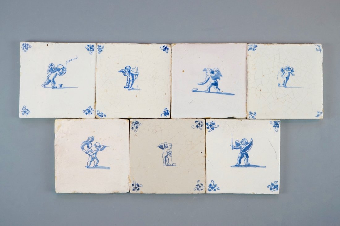 A set of 7 Dutch Delft blue and white tiles with putti (1 of 1)