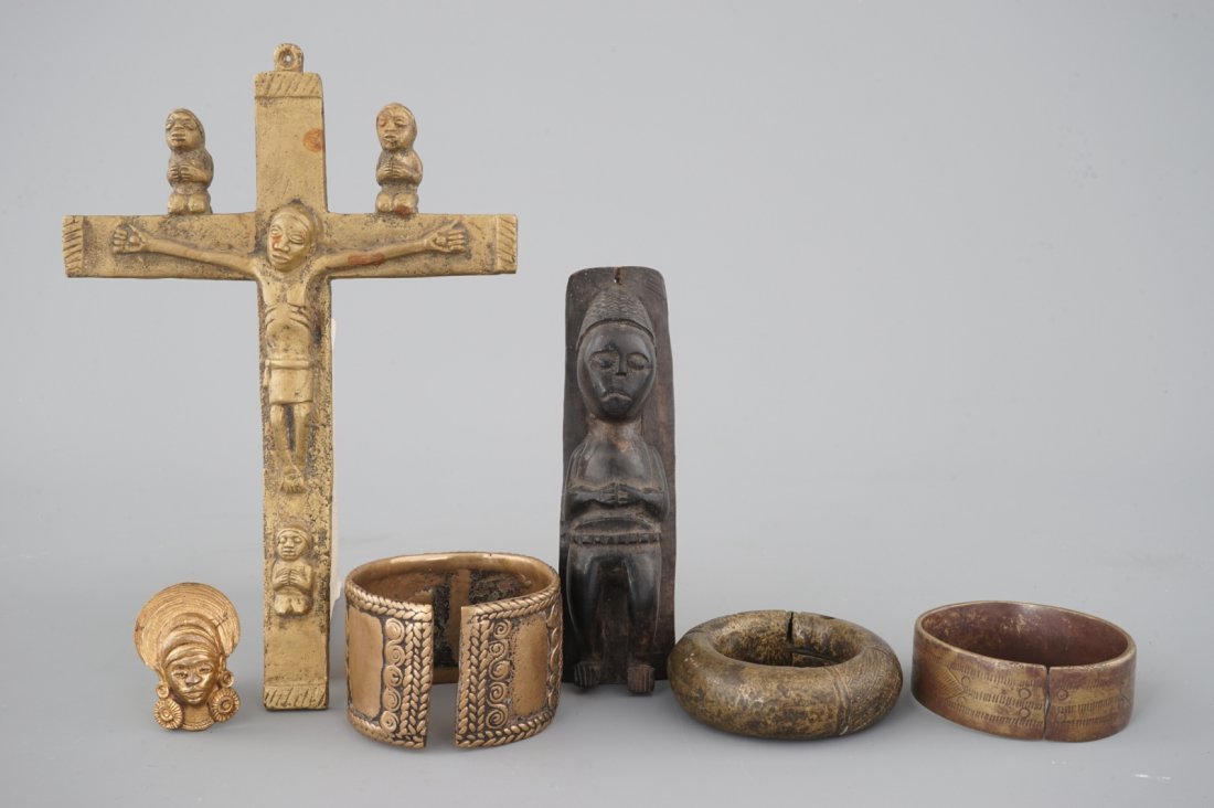 A selection of African bronze bracelets, a crucifix and (1 of 4)