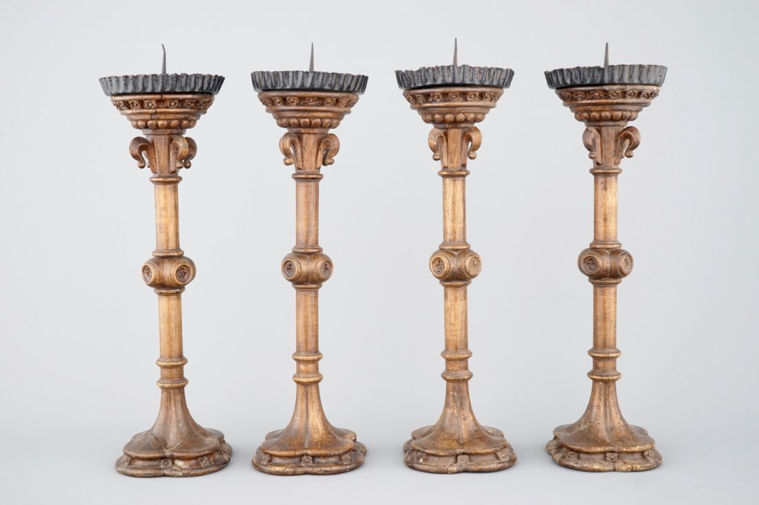 A set of 4 tall gothic revival wooden candlesticks, (1 of 6)