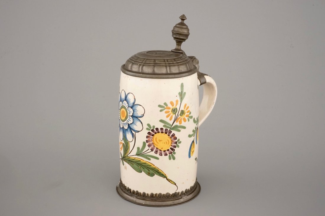 A beer stein with pewter lid and floral decoration,: H: 26,5 cm