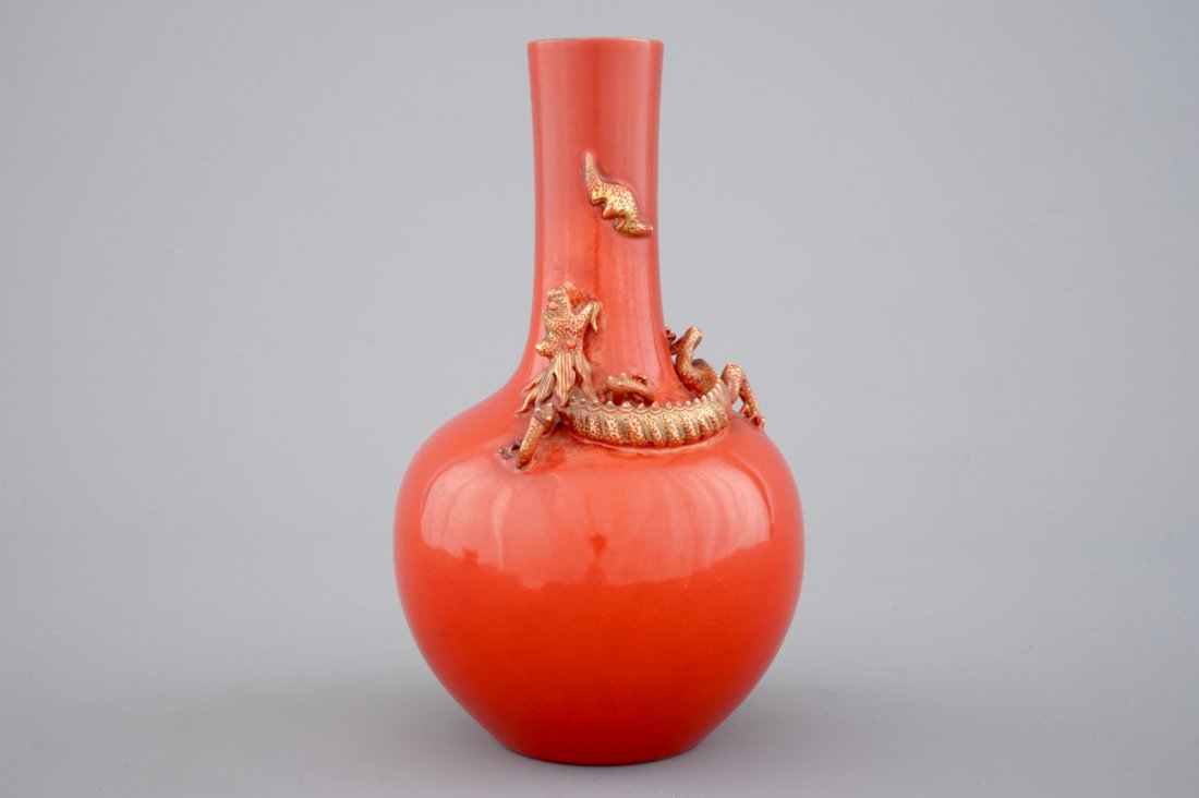 A Chinese porcelain coral red ground dragon vase, 19th: H: 22 cm