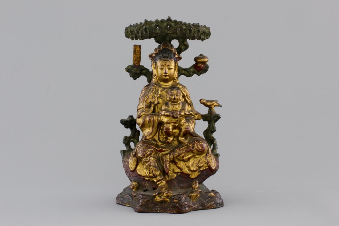 A Chinese bronze and gilt Buddha with child, seated (1 of 1)