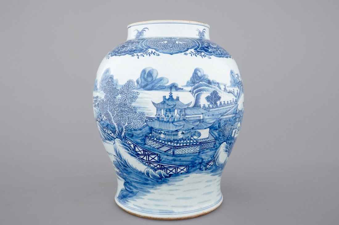 A tall blue and white Chinese porcelain landscape vase,: H.: 47 cm Condition: A small hairline going down from the top rim for 3,5 cm and a star-shaped line only visible inside.