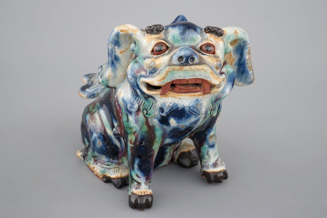 A Chinese Shiwan pottery foo dog, 19/20th C. (1 of 7)
