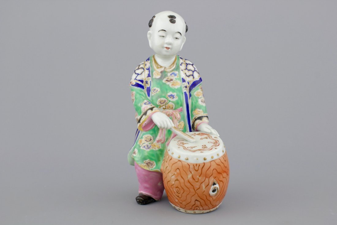 A Chinese porcelain polychrome figure of a drummer, (1 of 1)