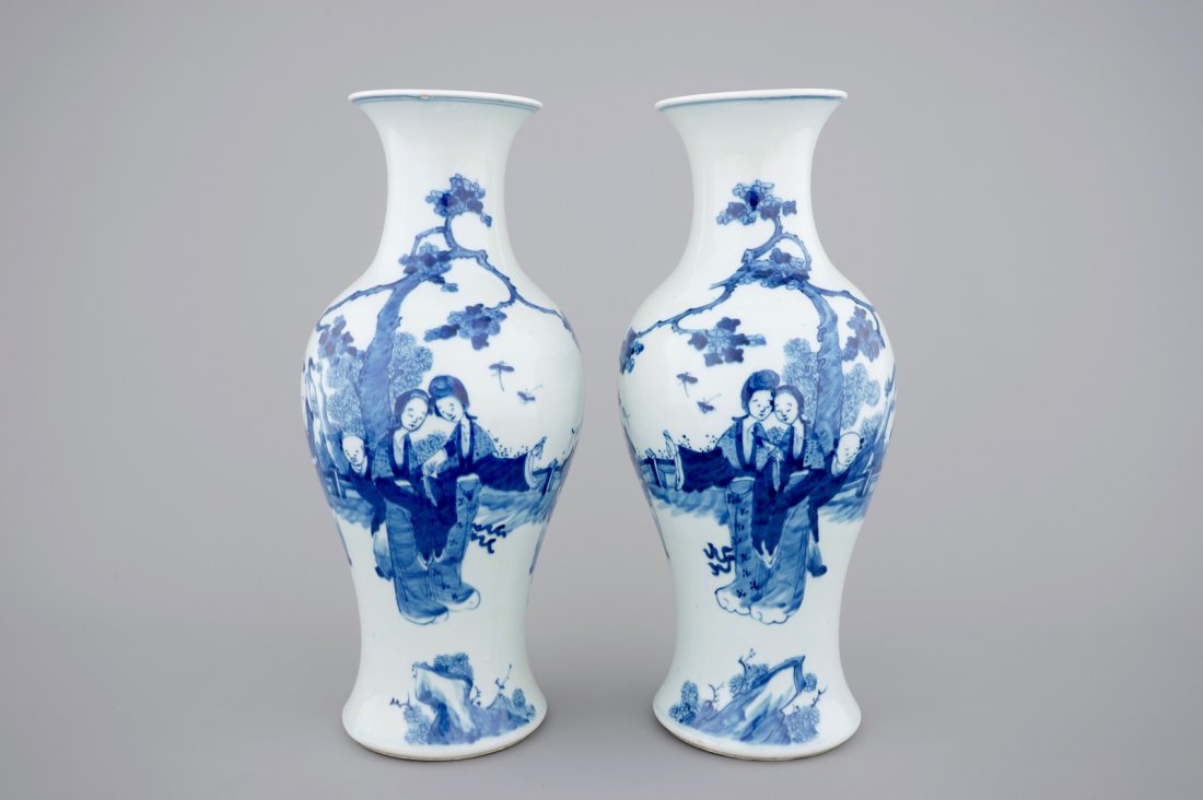 A pair of blue and white Chinese porcelain yenyen: H.: 45 cm Both vases with a hole in the base, drilled for wiring.