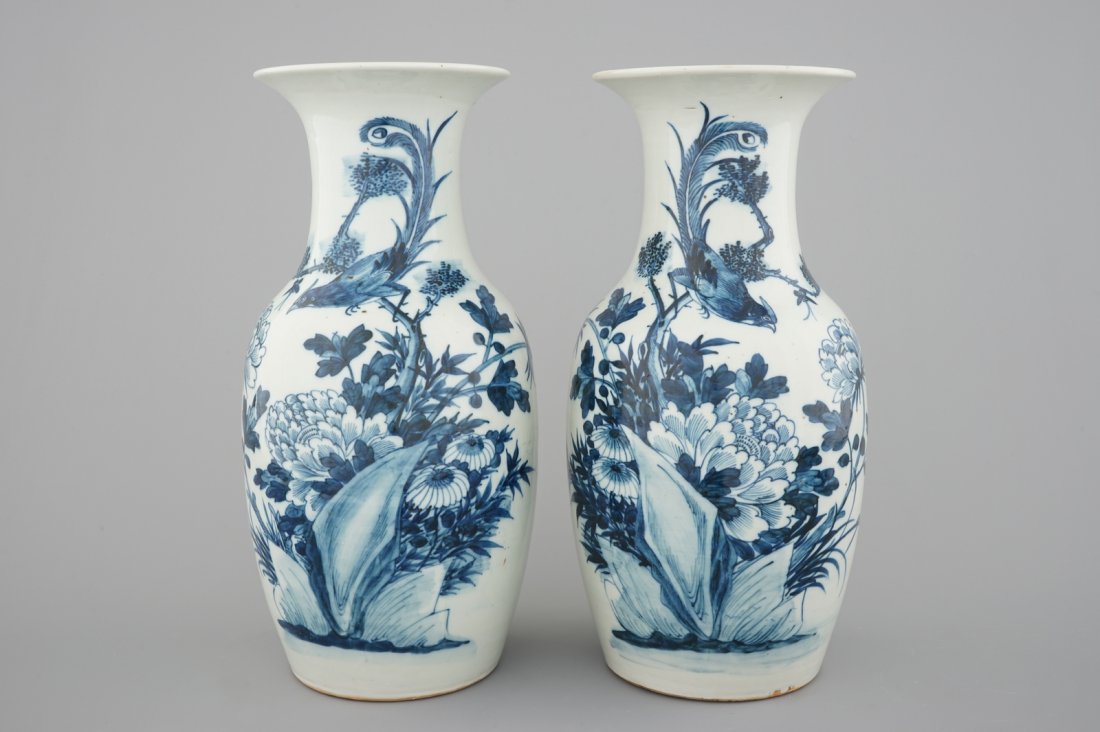 A pair of blue and white Chinese vases with birds among: H: 43 cm Condition: One vase with a faint vertical hairline in the body.