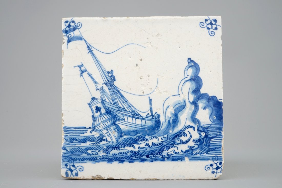 A Dutch Delft tile with a ship near rocks, late 17th C.: L.: 12,5 cm