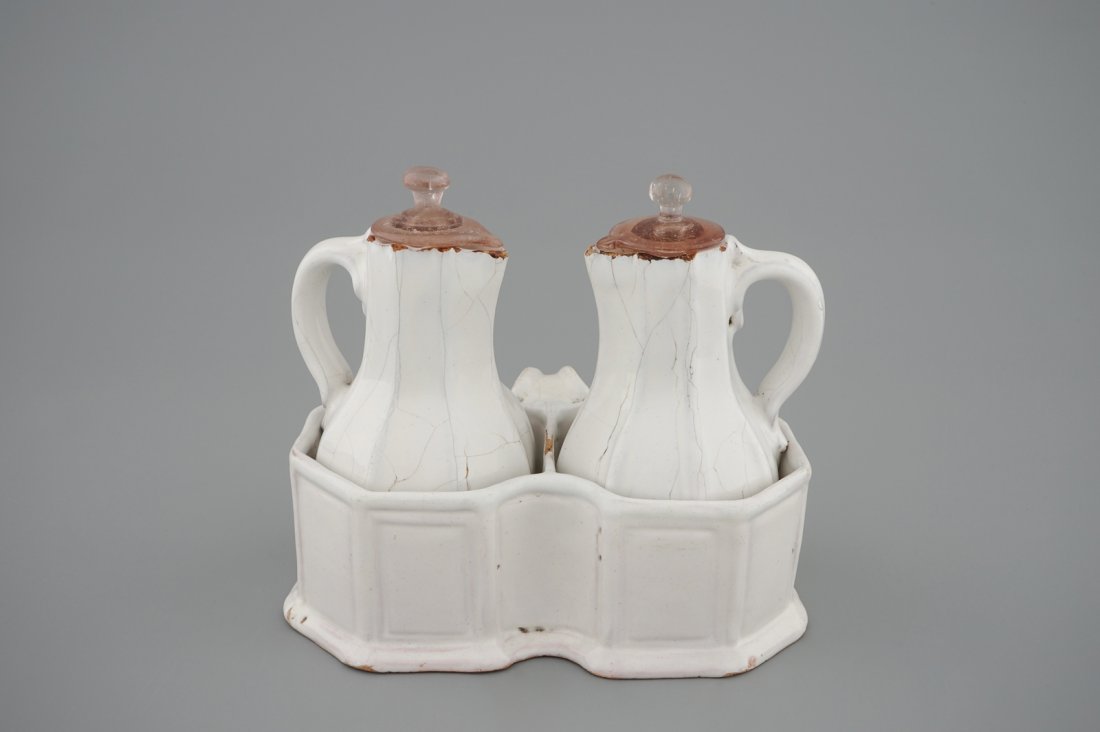A white Delft cruet set, 18th C.: H.: 17 cm Possibly of French origin.