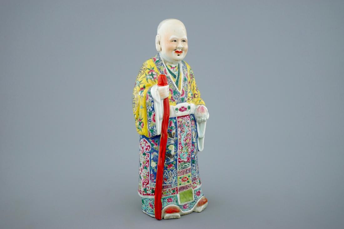 A Chinese famille rose figure of Shou Lao, 19th C.: A Chinese famille rose figure of Shou Lao, 19th C. H.: 31,5 cm - Base: 12,5 x 9,5 cm