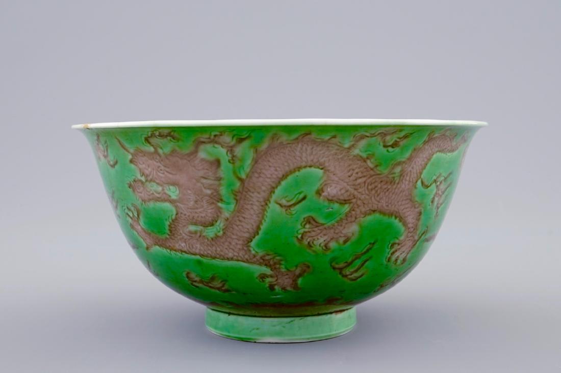 A Chinese green and aubergine dragon bowl, Kangxi mark: A Chinese green and aubergine dragon bowl, Kangxi mark and period Dia.: 11 cm - H.: 5,5 cm Provenance:- A private collection, Belgium- Acquired in London in the 3rd quarter of the 20th C. See also: - 
