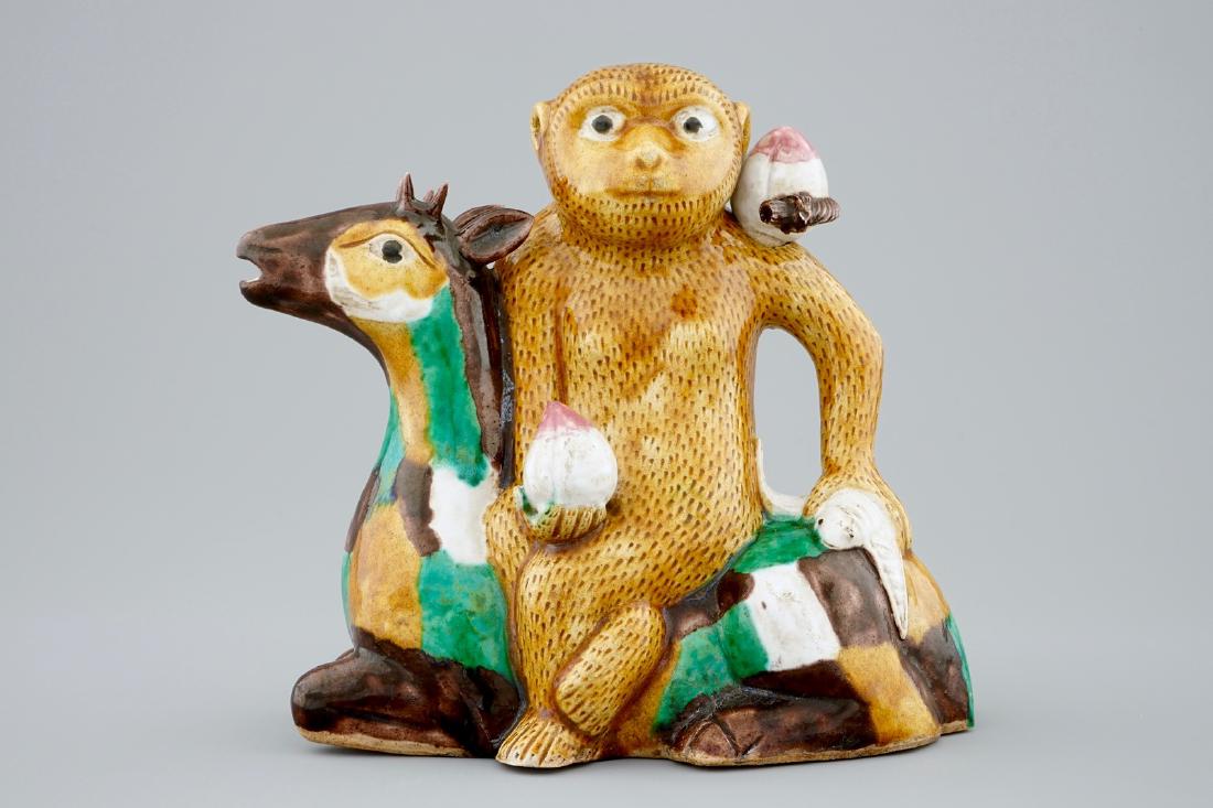 A Chinese famille verte biscuit ewer in the shape of a (1 of 7)