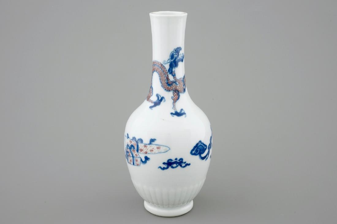 A Chinese blue and white and underglaze red vase with a (1 of 7)