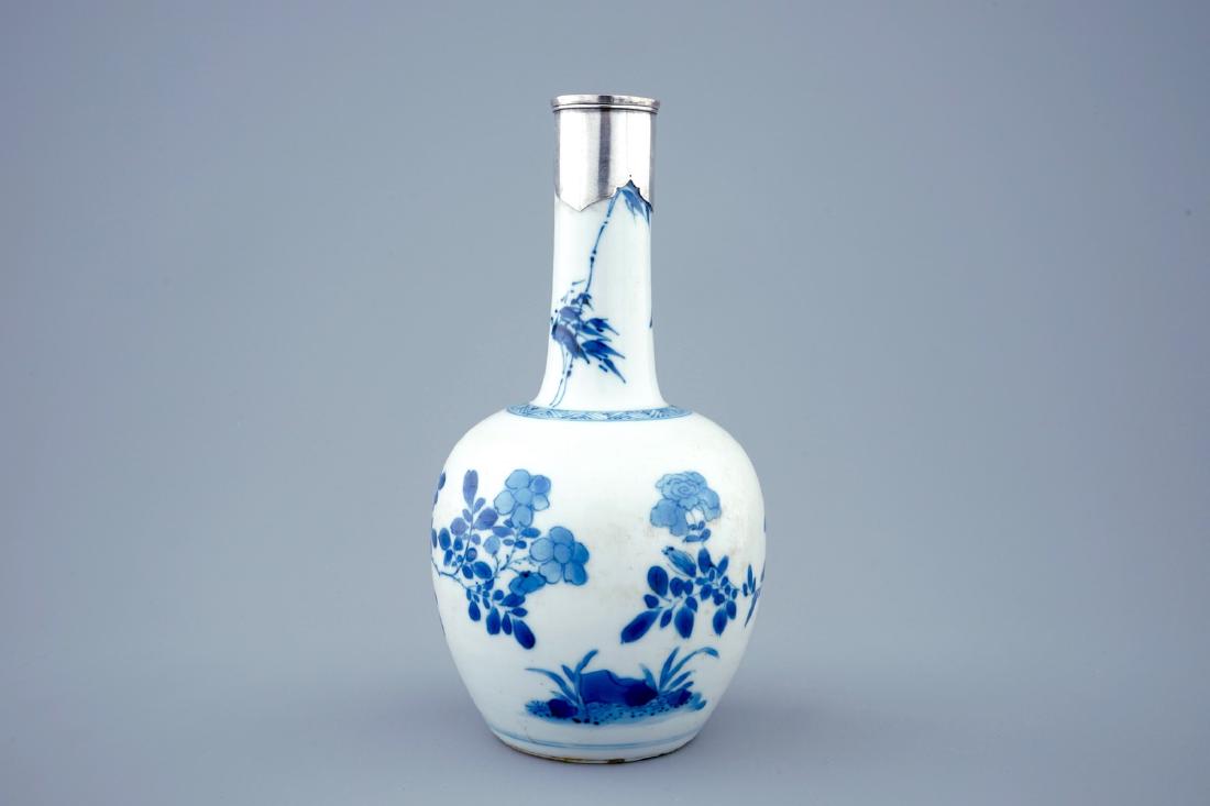A Chinese blue and white bottle shaped vase with silver (1 of 6)