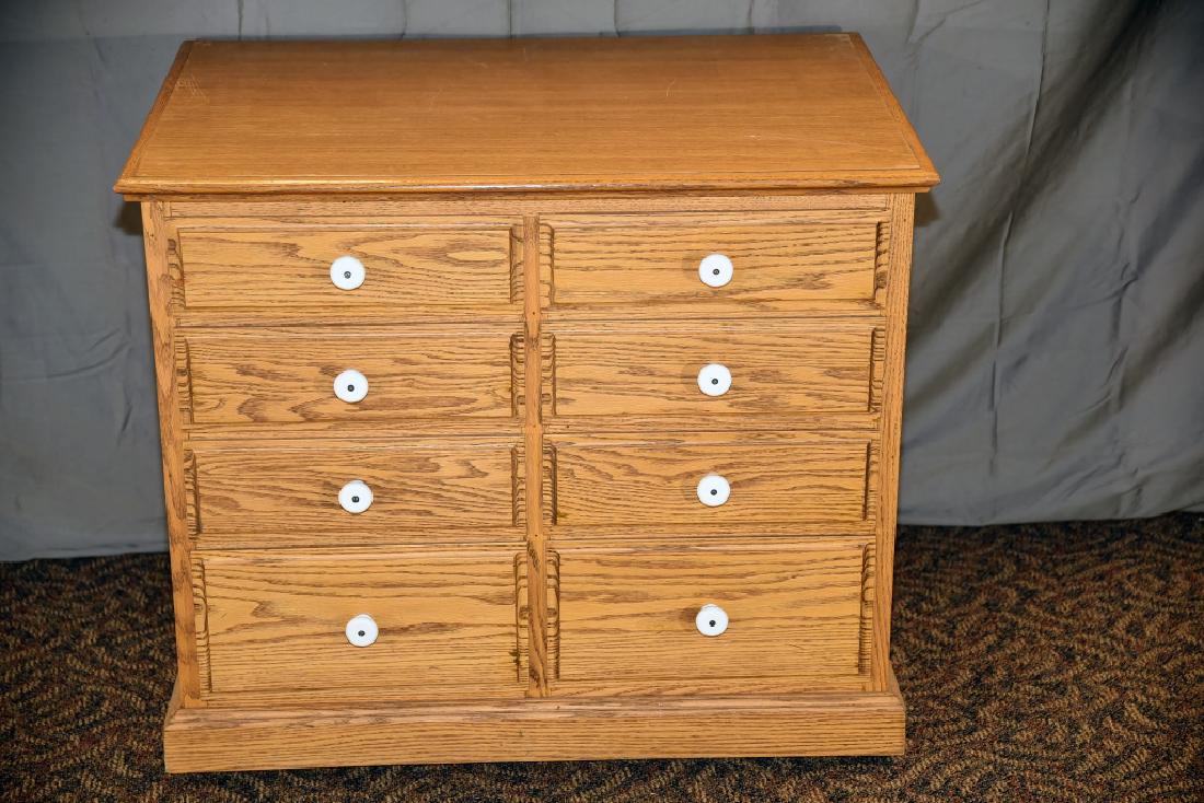 8 Drawer Oak Cabinet on Wheels: A newer piece. 34" wide x 24" deep x 29" tall