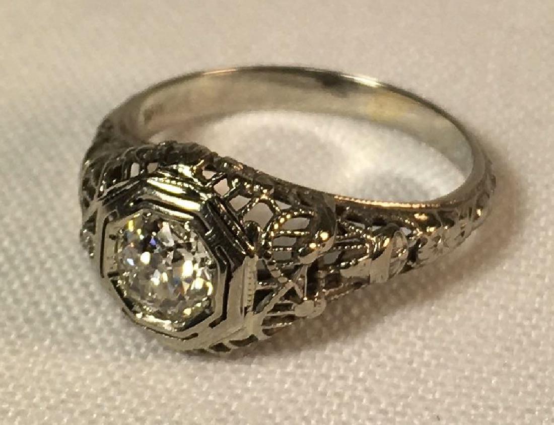 18K White Gold .60 Ct. European Cut Diamond Ring: A stunning antique art deco filigree ring in 18K white gold with an approximate .60-.65 Ct. European cut diamond. The approximate total weight of the ring is 2.5 grams. The ring size is approximately 