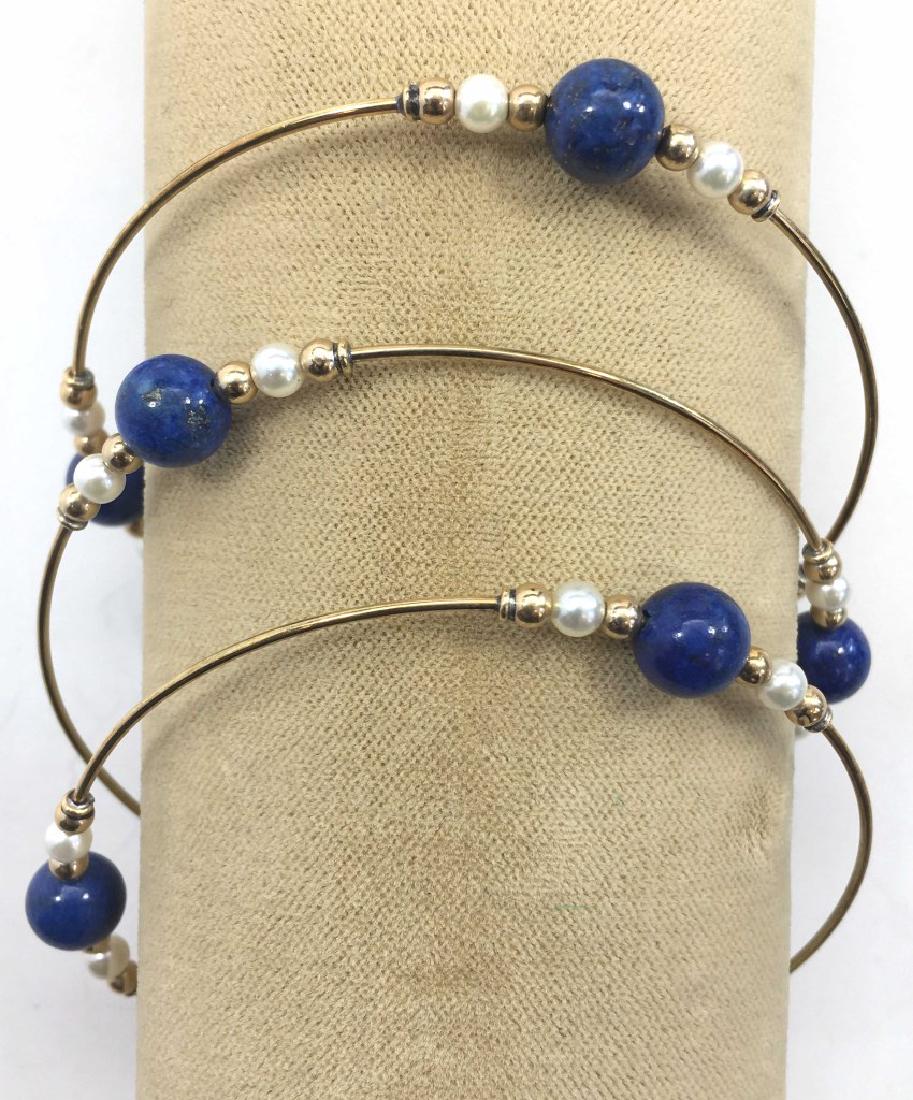 3 Gold, Lapis and Cultured Pearl Bangle Bracelets: Lapis beads and cultured pearls with gold spacers which are unmarked but probably 14K. Condition: There is some denting on the gold spacers.