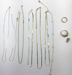 Mixed 14K, 10K, XXX Gold Scrap Jewelry: The chains are all 14K and grouped together weigh approximately 20.6 grams. The gold wedding band which has been cut is marked XXX, it weighs approximately 3.3 grams. The empty ring setting and cross