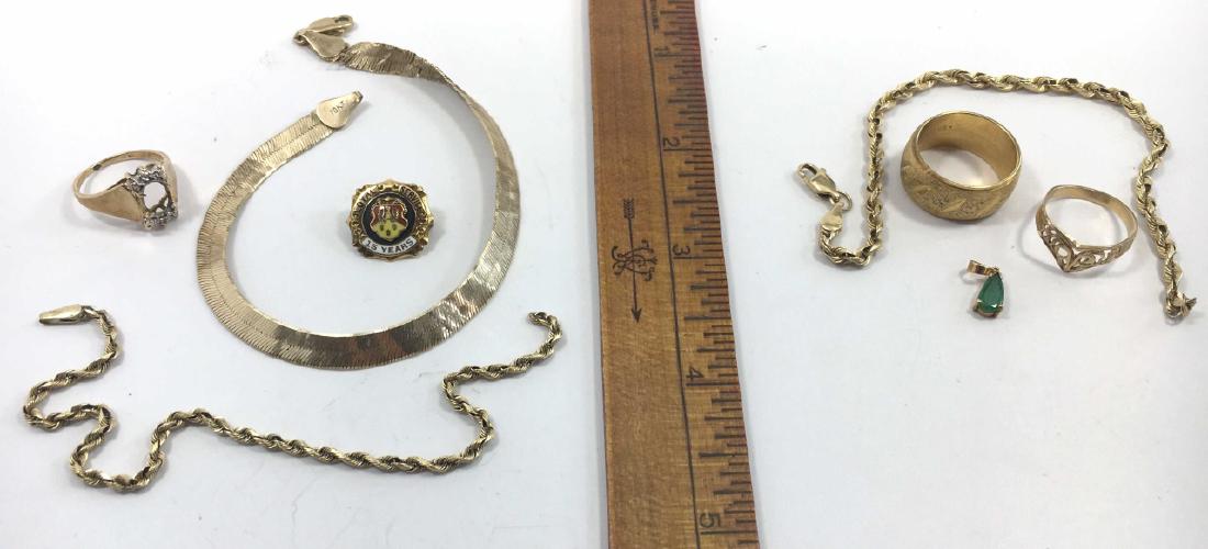 14K and 10K Scrap Gold, Emerald ?: The 4 pieces on the right including 2 rings, a piece of chain and a small emerald? are 14K. Together, their total weight is approximately 11.3 grams. The 4 pieces on the left including a ring setting,