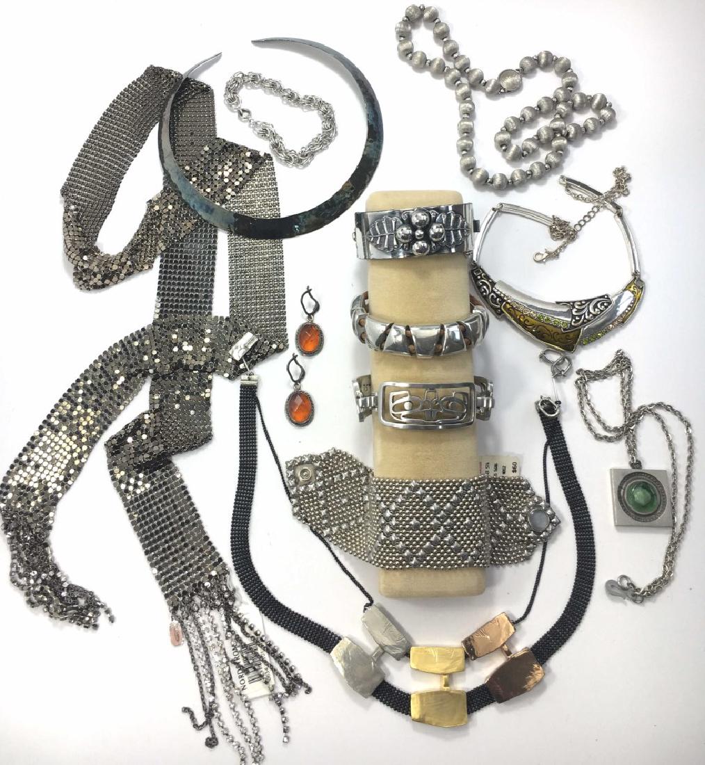 Contemporary Silver Designer Costume Jewelry Lot: Vintage and modern designer costume jewelry in silver tones make up this lot. It includes pieces signed Anne Marie Chagnon, AYE, R Tenn Sweden, Tasha and more as shown.
