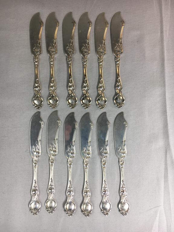 Wallace Violet Sterling Silver Butter Spreaders: From Wallace Silversmiths, 12 sterling silver flat handle butter spreaders. Each measures approximately 6" long. Total weight is 234.68 grams.
