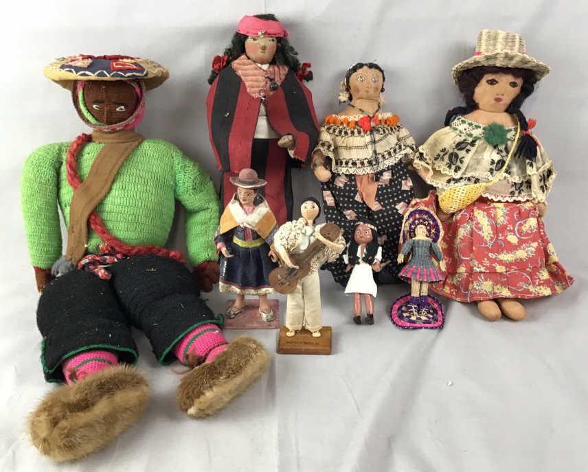 8 Vintage & Antique Global Costume Dolls The largest: The largest measures approximately 18" long.