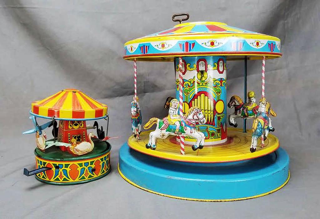 2 Pressed Steel Merry-Go-Rounds - Chien & Ohio Art: 2 Pressed Steel wind up merry-go-round toy circa 1940's-1950's. The larger one is a 1950's J. Chien measuring approximately 12 inches in diameter and 10.5 inches tall, while the smaller Ohio Art measu