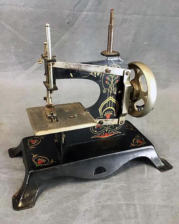 Miniature Table Top Sewing Tin Sewing: Tin and iron antique miniature table top sewing with a painted Japanned finish. Approximately 7 1/2" tall.