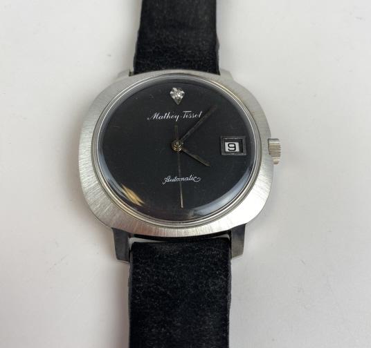 Mathey-Tissot Midcentury Modern Wristwatch: Stainless steel men's automatic self winding with calendar. Appears to be working though it has not been fully tested. Includes Original suede leather band box and service manual.