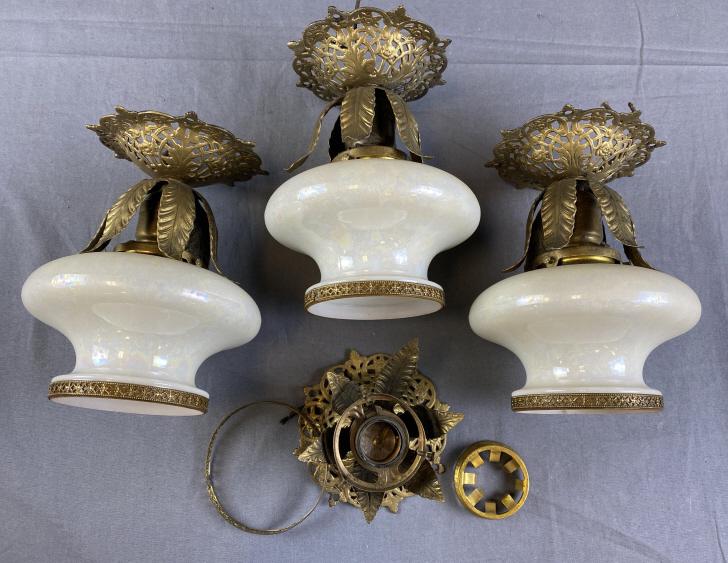 Set of 4 Early 20th C. Ceiling Light Fixtures: Gold painted metal filigree, 3 retain their original opalescent glass shades with the 4th missing. Each fixture measures approximately 8" long.
