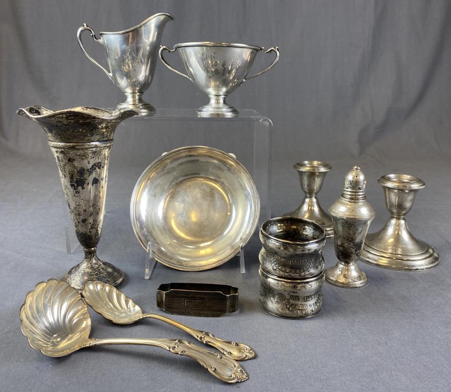 Group of Vintage Sterling Silver Table Ware: Includes a monogrammed creamer and sugar weighing 197 grams, 2 serving spoons weighing 84 grams, a small bowl weighing 87 grams, a weighted vase weighing 158 grams, a pair of weighted candleholders we
