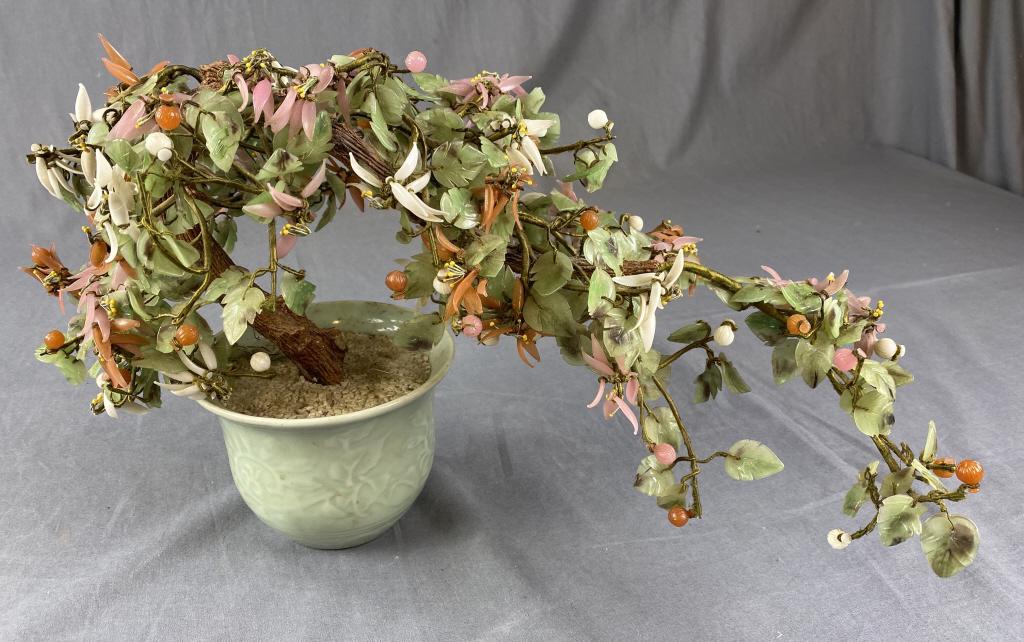 Decorative Vintage Chinese Jade Bonsai Tree: Measures approximately 19" long and 11" tall. It is a bit smashed down and needs adjustment. There are some broken leaves and petals. From an estate of the family of R. E. Olds of Lansing, Michigan.