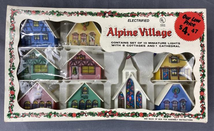 1960s Alpine Village Plastic Christmas Lights: Vintage lighted plastic buildings for holiday decorating circa 1960s. Includes the string of lights, plastic buildings and the original box.