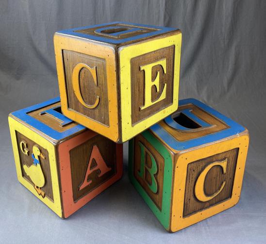 3 Wolf Creek Oversized Folk Art Display Blocks: Each measures 10" x 10" x 10". Some wear and patina as shown. Made by Wolf Creek of Eldora Iowa.