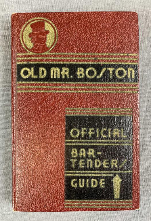 Old Mr Boston Deluxe Official Bartender's Guide: Leo Cotton, published by Ben Burk Inc., Boston (1935) second printing. Hardcover with some wear, a small piece of tape on the end paper and a pencil written recipe for whiskey sours on the copyright p