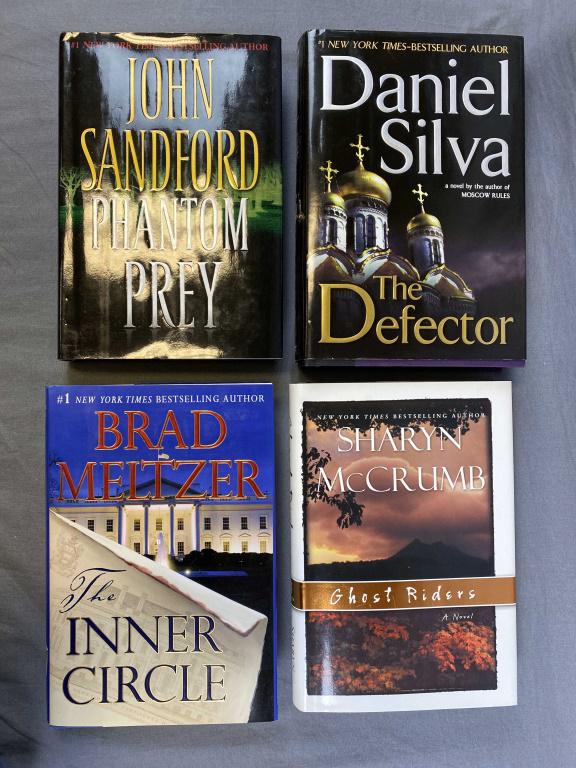 4 Author Signed Novels: Includes "Phantom Prey" by John Sandford 2008 - signed, "The Defector" by Daniel Silva 2009 - signed, "The Inner Circle" by Brad Meltzer 2011 - signed first edition and "Ghost Riders" by Sharyn McCrum