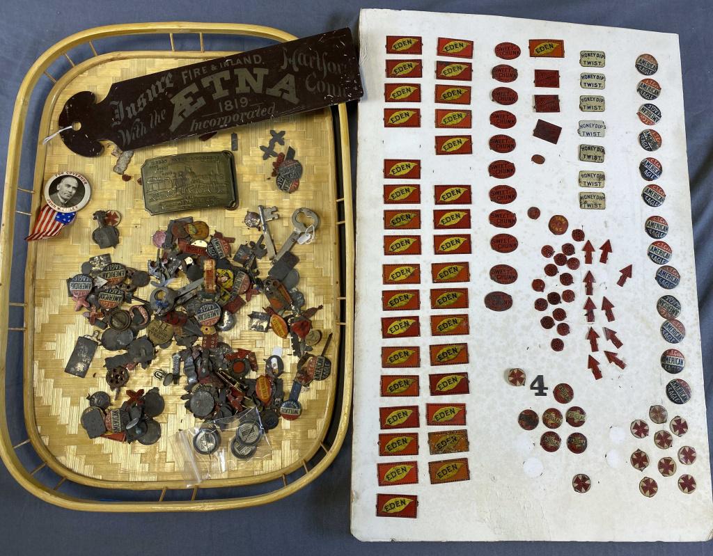 Advertising Ephemera Including Tin Tobacco Tags: Also includes a tin Aetna ledger marker and a Wells Fargo brass buckle marked "Tiffany New York" on the back.