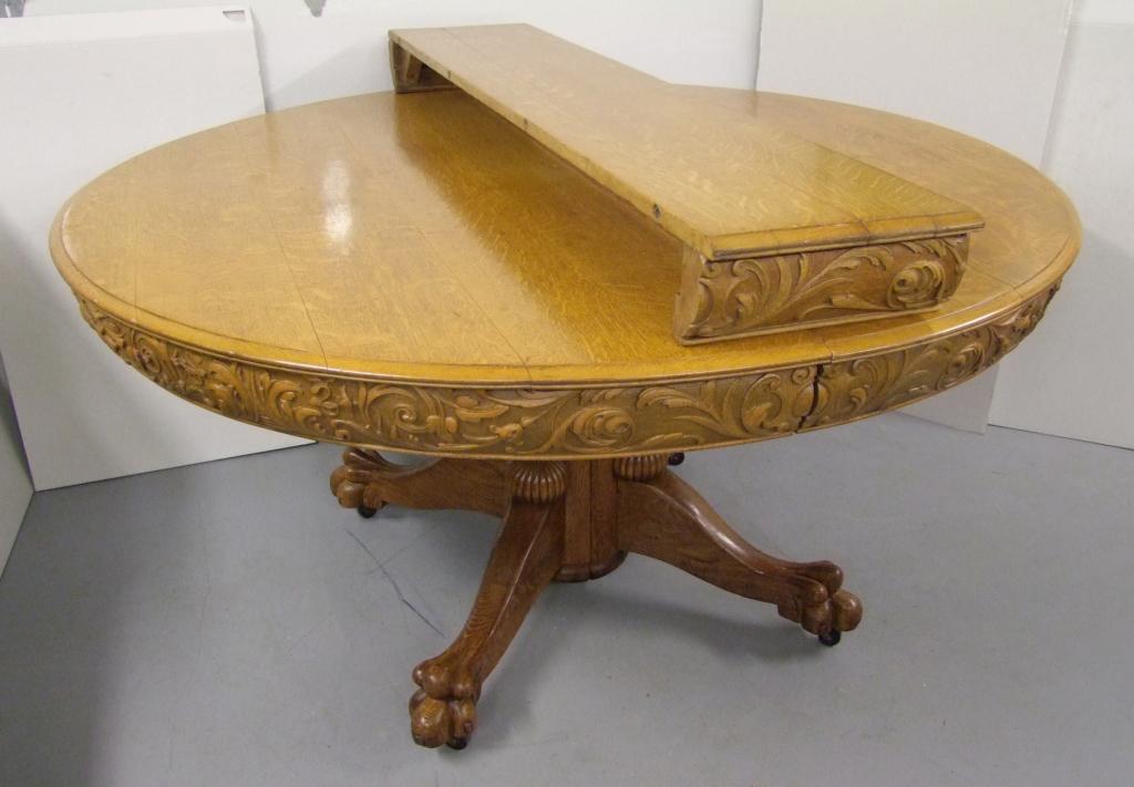 C/1890 Round Oak Dinning Table: C/1890 Round Oak Dining Table, Quartered Oak Throughout, Heavily Carved Apron With Original Oak Leaf (Has Matching Carved Apron), Robust Claw Feet, Hidden Center Leg Present But Not Installed, 60̶