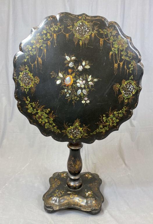 19th C. Papier Mache, Mother of Pearl Tilt Top: Table. Victorian papier mache tilt top table with mother of pearl inlay, hand painting and giltwork. The top measures 25 1/4" in diameter and the height is 26 1/2" tall. Condition: The tilt mechanism