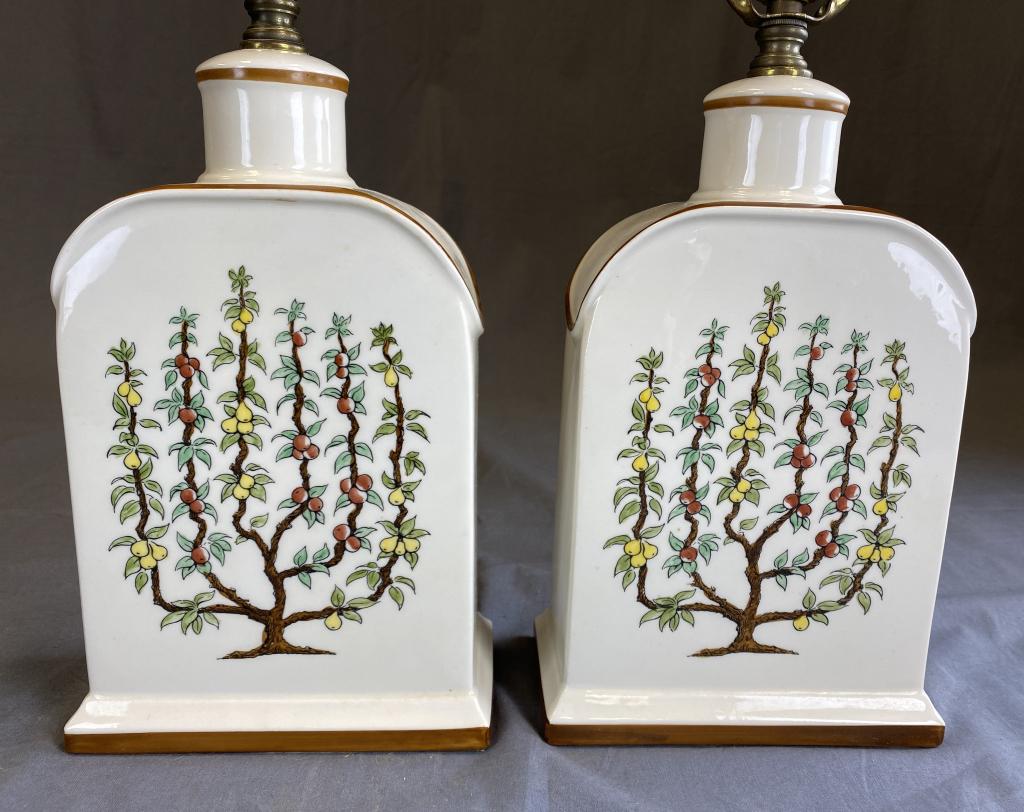 Pair Hand Painted Porcelain Lamps Espaliered Trees: Vintage Asian flask styled porcelain lamps with hand-painted espaliered tree designs. H. To top of finial 24 1/4" SHIPPING: In House Shipping Available.