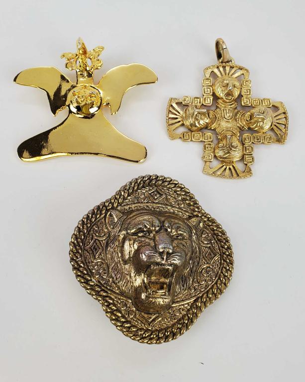 Vintage Mexican Tribal Pendants And Buckle: Two large gold plated Mexican Tribal. One large Lion belt buckle. They are marked but unable to determine.