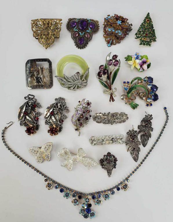 Art Deco To 50's Jewelry Lot With Sterling Silver: A great lot of jewelry. (3) art deco scarf clips, (1) Sandor Christmas tree brooch, Lucite and rhinestone brooch, enamel and rhinestones. Jon Anton bone China. Peru JFM Llama. 925. Marcasite and garne