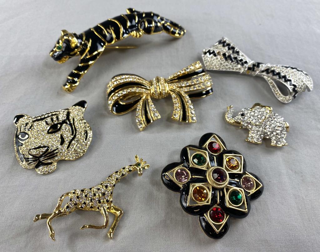 7 Vintage Rhinestone and Enamel Brooches: A large shoulder perching panther in black enamel with emerald green eyes and six other chic brooches.