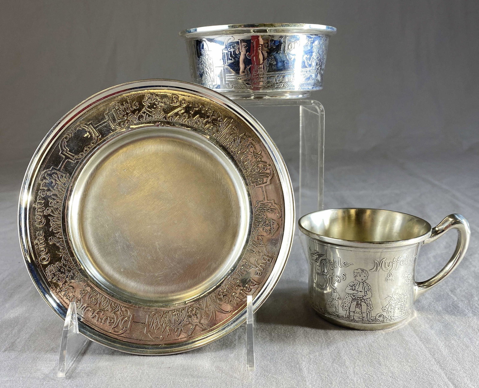 Cartier 3 Piece Sterling Silver Nursery Set: A 3 piece sterling silver nursery set for possibly Lebkuecher & Co. for Cartier, fully marked for Cartier as shown. Includes a 6" diameter plate weighing 146 grams, a 4 1/4" diameter bowl weighing 122