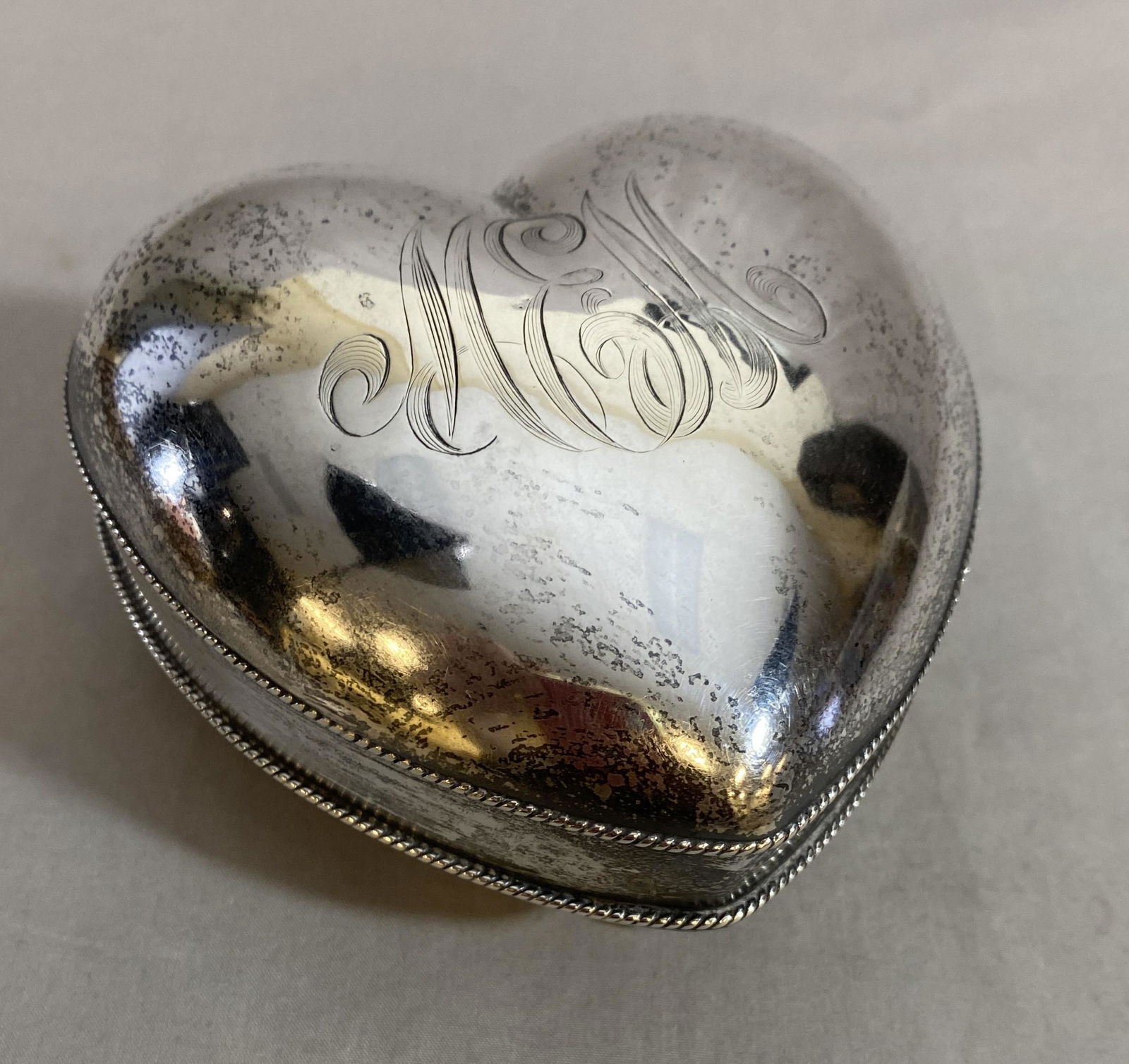 Sterling Heart Shaped Trinket Box Circa 1900: From an estate of the children of Marian E. Martin (Dixon) a Chicago socialite and opera singer. Monogrammed "MEM". Marked Sterling 925 and T P Co possibly indicating Tucker-Parkhurst of Ogdensburg NY