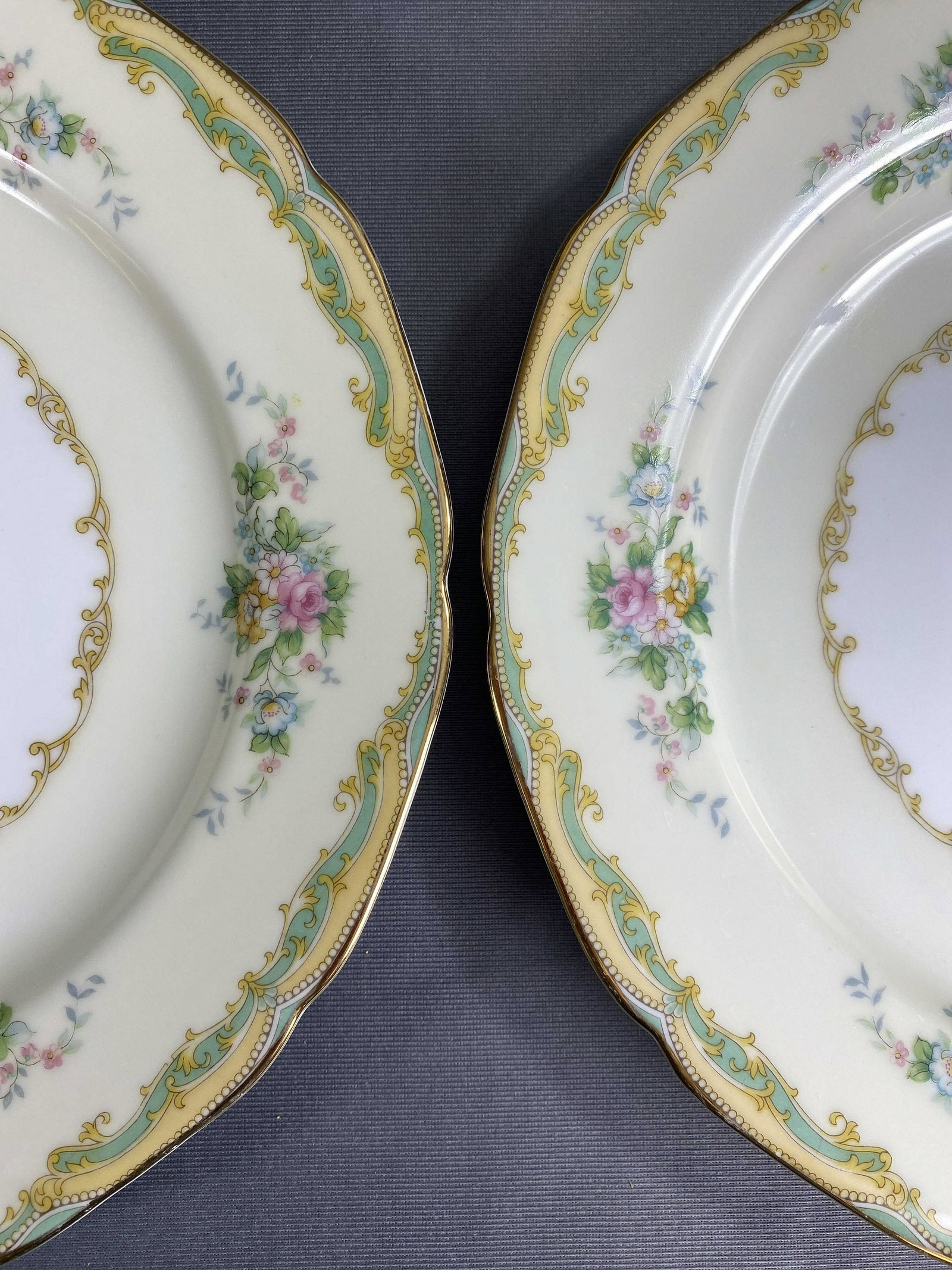 Noritake "Larue" Place Settings for 10-12+: Noritake porcelain set circa 1933, floral sprays with a green border. Includes: (12) 10" dinner plates, (11) 7 3/4" salad plates, (10) 6 1/4" bread & butter plates, (11) 8" rim soup bowls, (10) 5 1/2"
